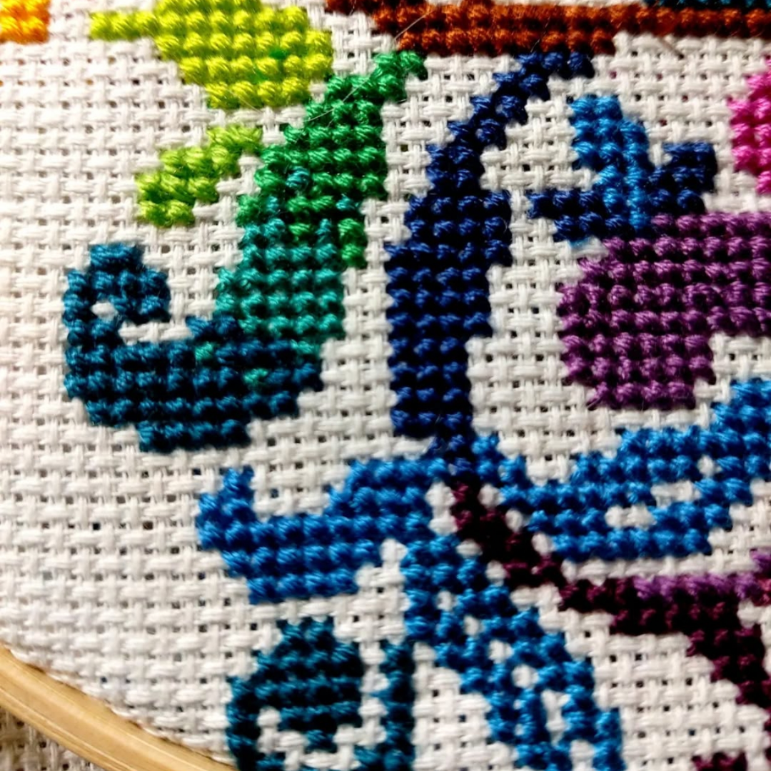 Cross stitch detail of the Tree of life colorful pattern