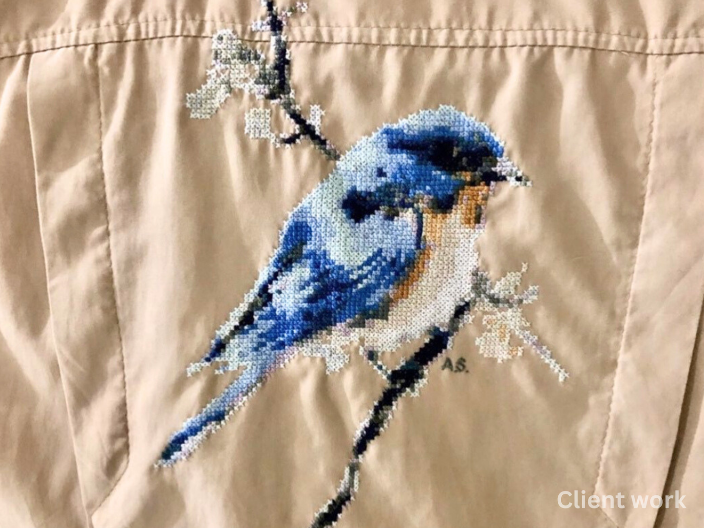 Finished Western bluebird cross stitch embroidery on Jacket