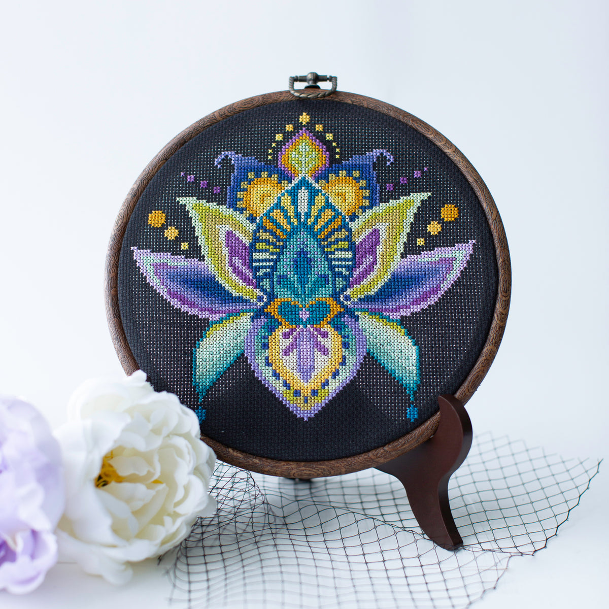 Cross stitch lotus flower in embroidery hoop
