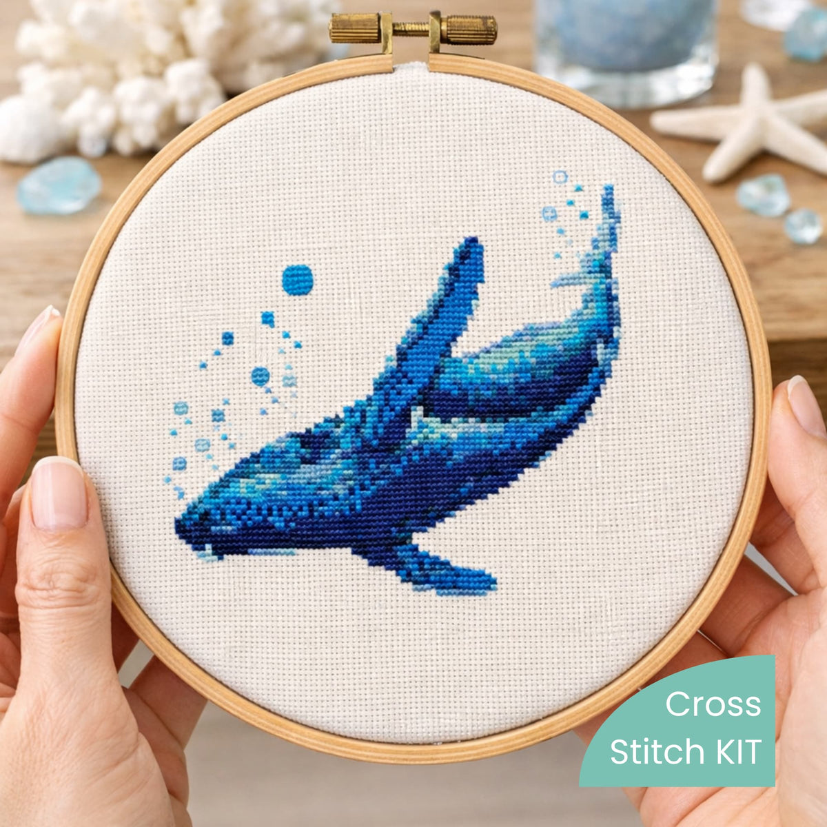 Blue Whale Counted Cross Stitch Kit stitched in wooden embroidery hoop, whale embroidery kit, ocean animal needlework set for marine life lovers.