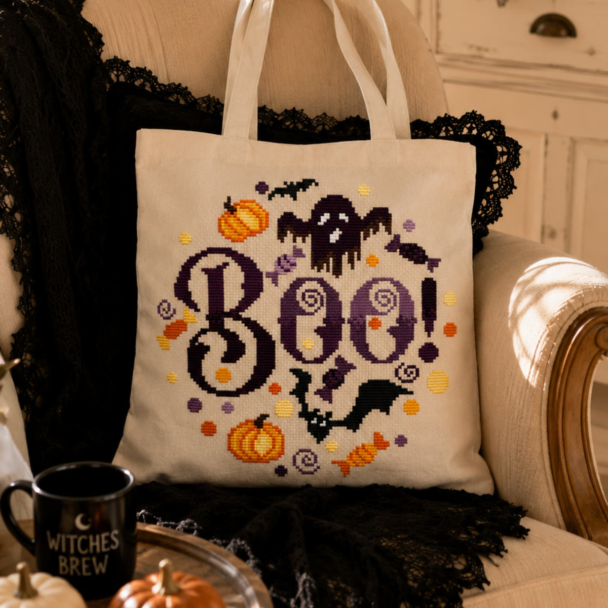 Boo Halloween cross stitch pattern PDF displayed on tote bag, modern spooky embroidery design for Halloween lovers.