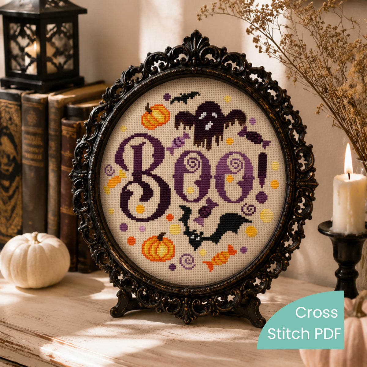 Boo Halloween cross stitch pattern PDF shown in ornate black frame, gothic spooky embroidery wall decor artwork.