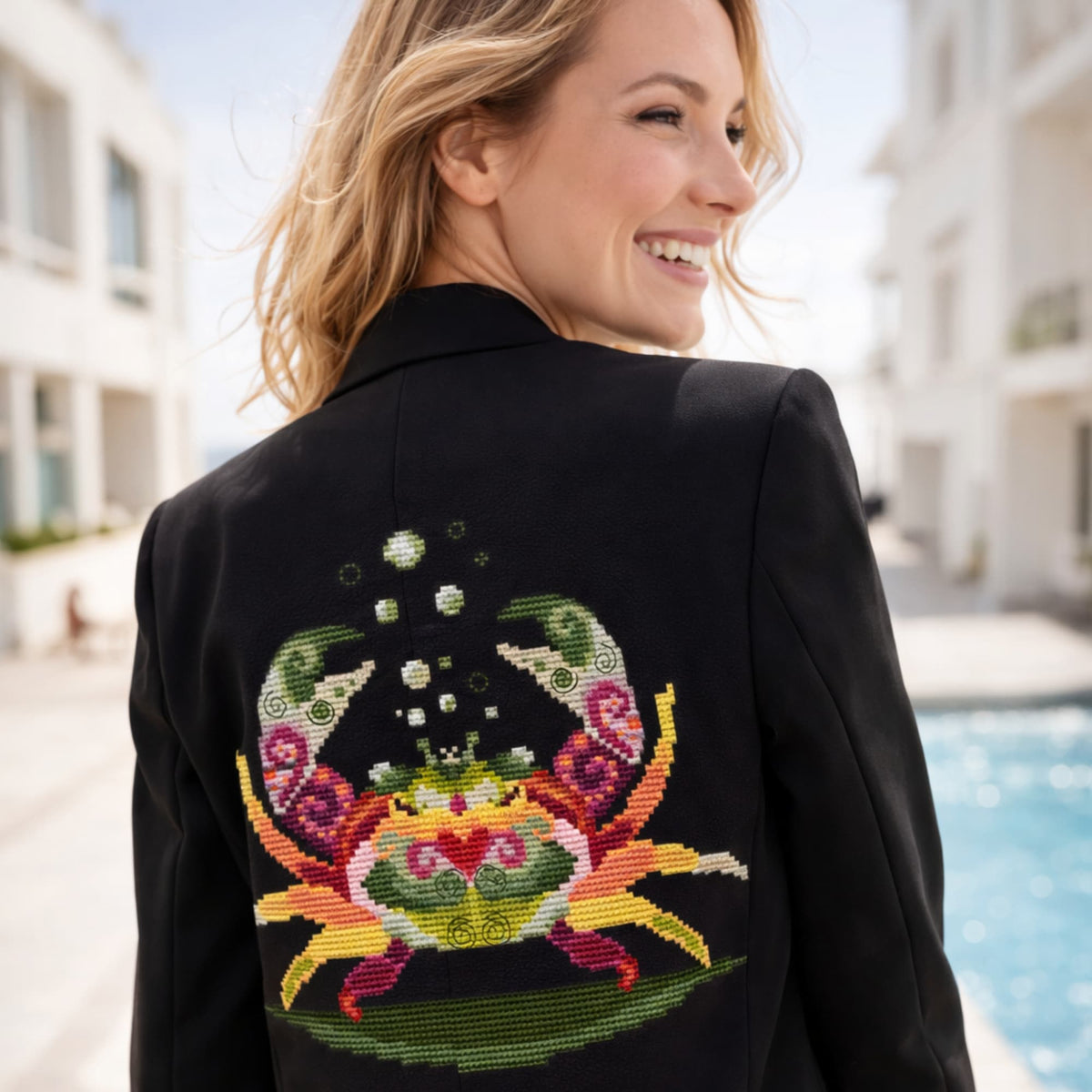 Colorful crab counted cross stitch pattern PDF displayed as embroidery design on black jacket back