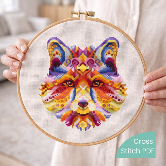 Colorful fox cross stitch artwork held in a wooden embroidery hoop, modern geometric animal embroidery design
