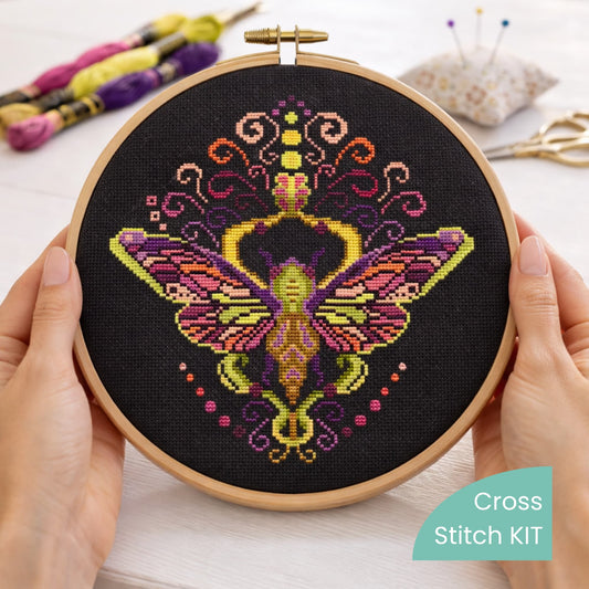 Counted Cross Stitch Kit Colorful Purple Moth – Folk Ornament Moth Embroidery Kit displayed in wooden embroidery hoop