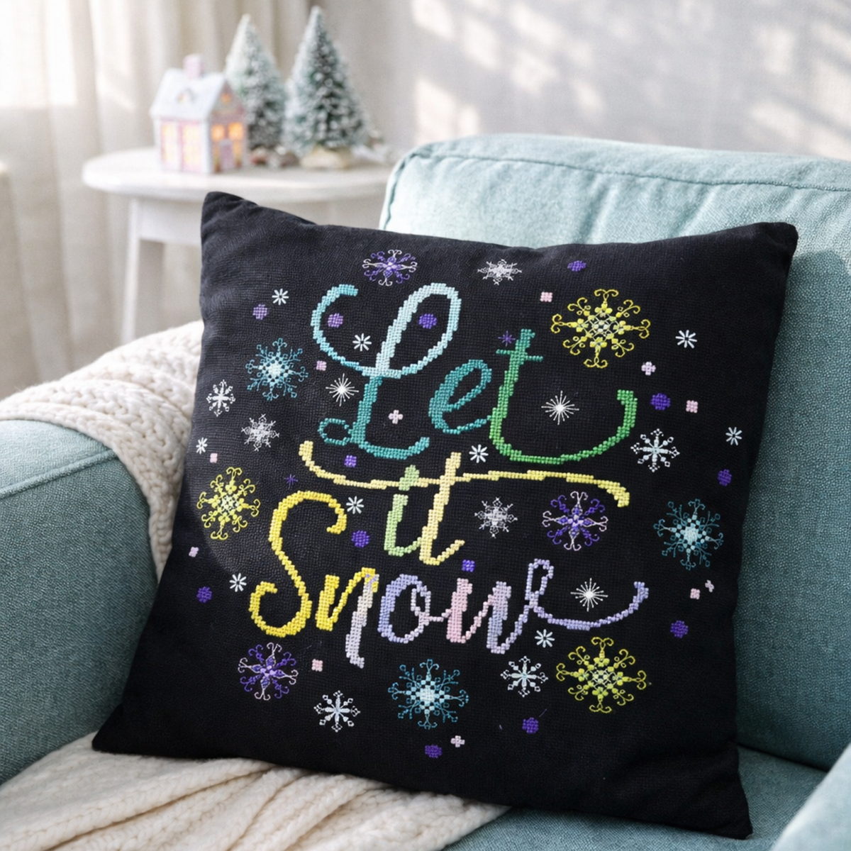Cross Stitch Pattern Let It Snow PDF – Festive Winter Snowflake Embroidery Design stitched on decorative pillow