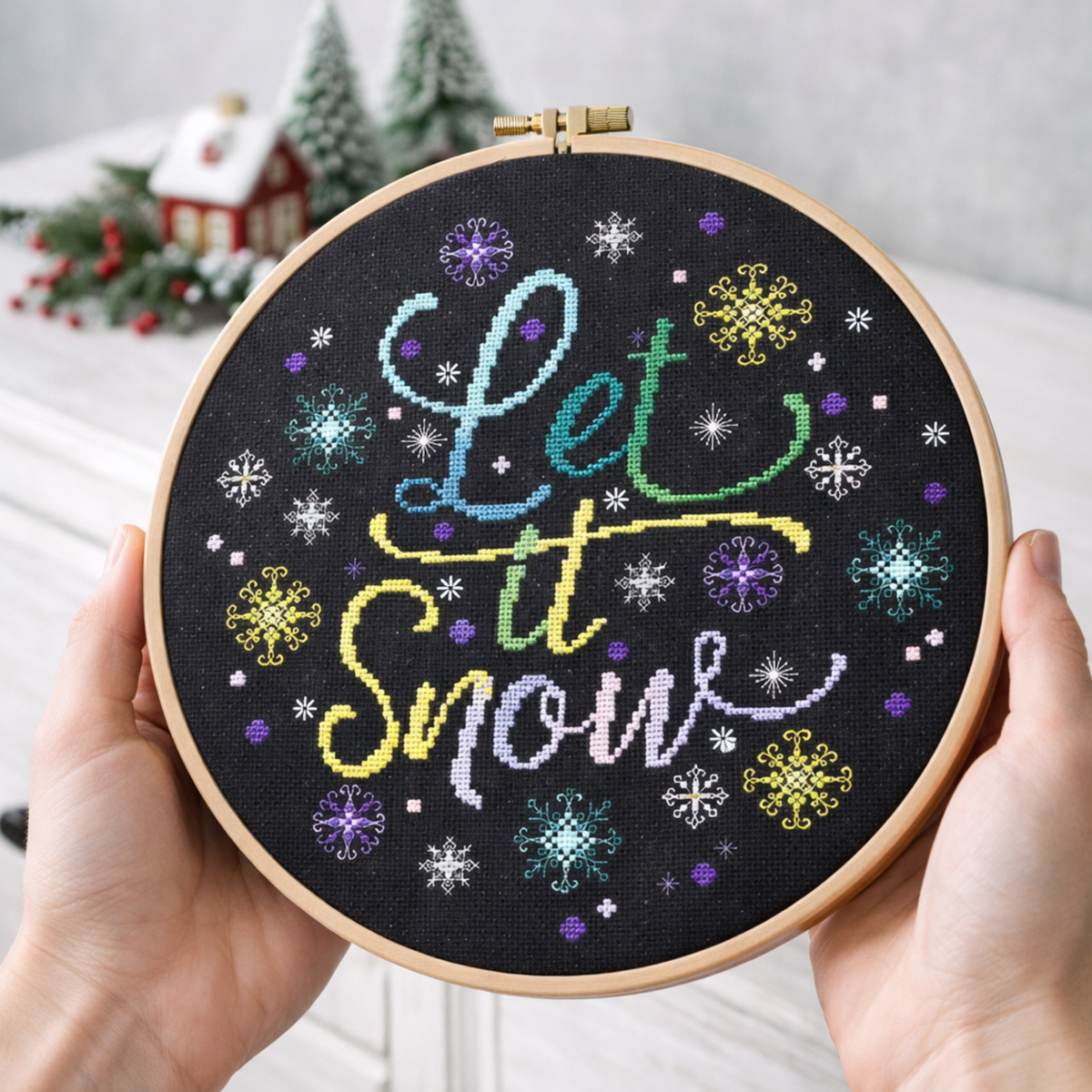 Cross Stitch Pattern Let It Snow PDF – Winter Snowflake Cross Stitch Pattern displayed in embroidery hoop held in hands
