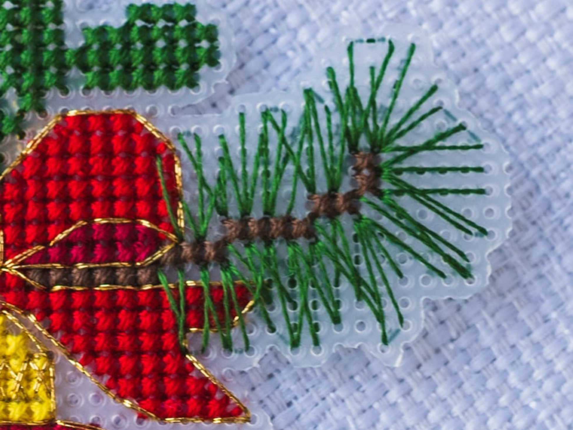 Cross stitched red ornament detail