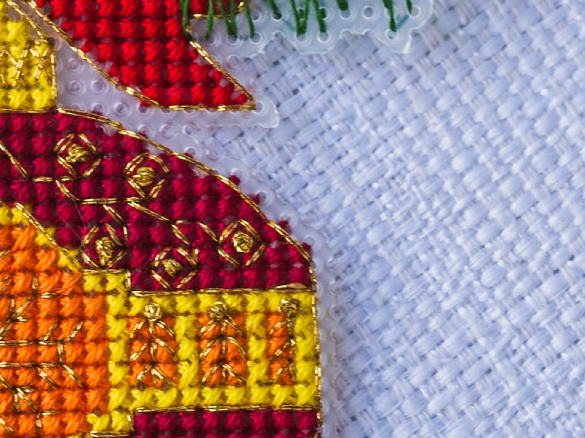 Cross stitched red ornament detail