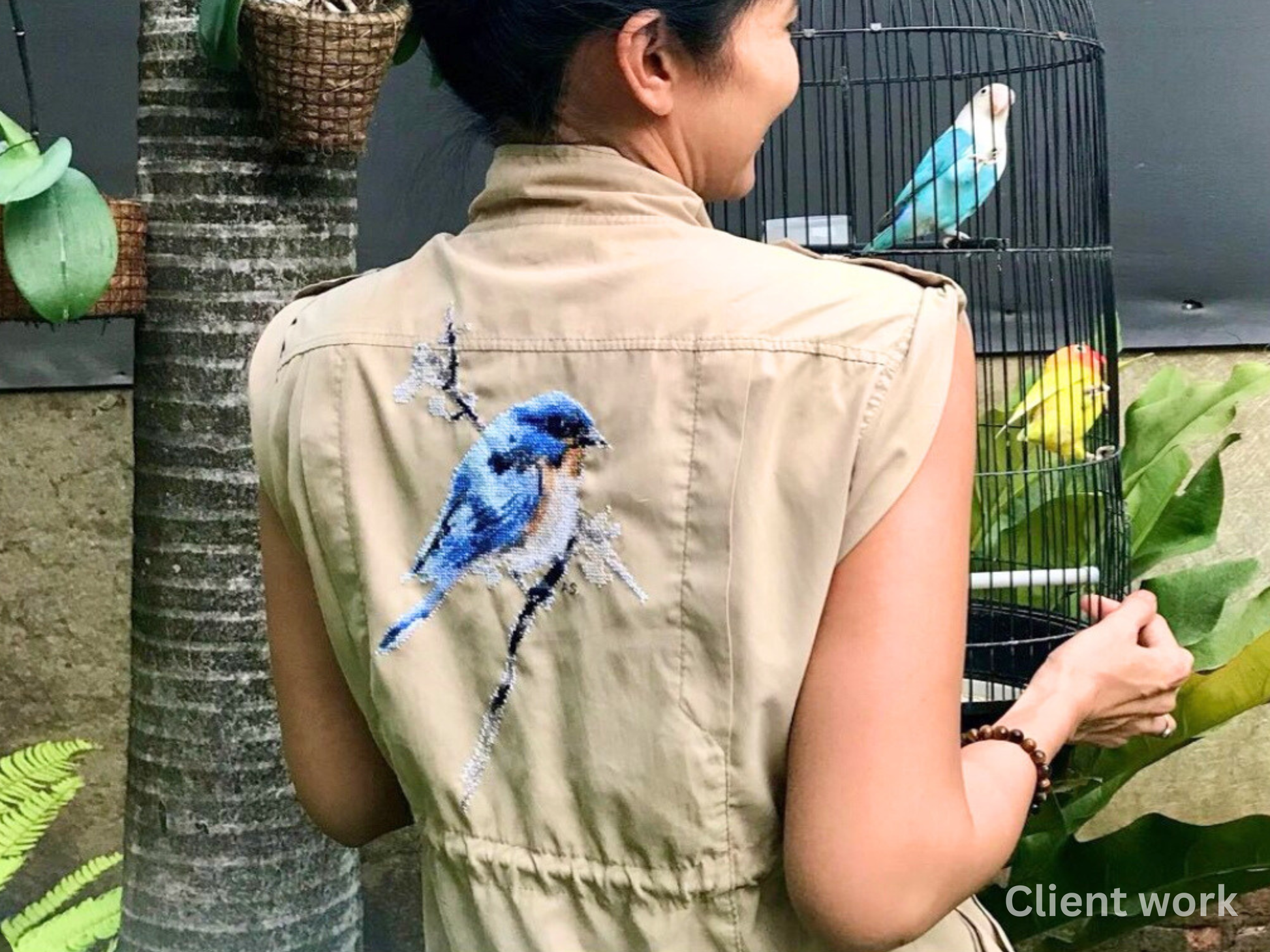 Finished Western bluebird cross stitch embroidery on vest