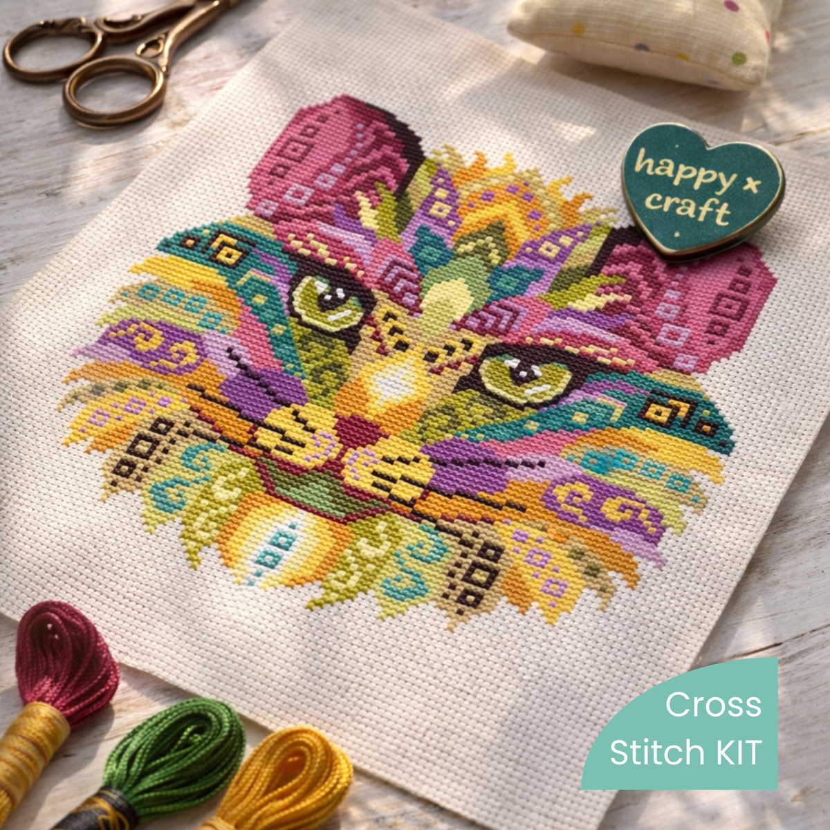 Finished folk cat embroidery on Aida cloth with embroidery floss and tools, complete counted cross stitch kit with threads, fabric and instructions.
