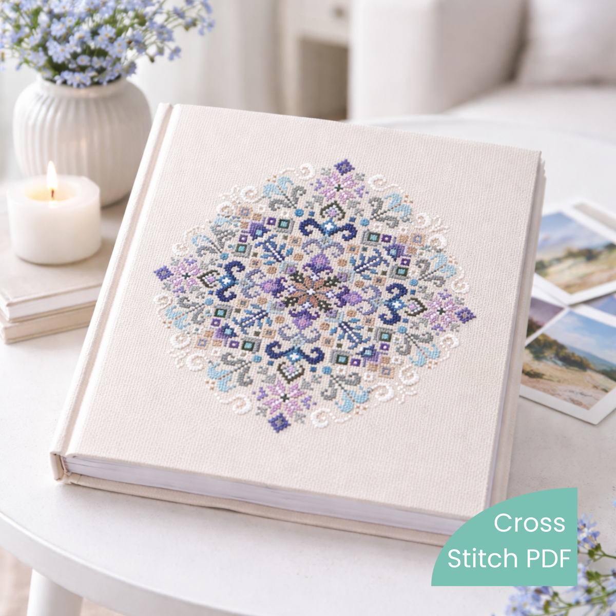 Hand-embroidered geometric mandala cross stitch on fabric book cover