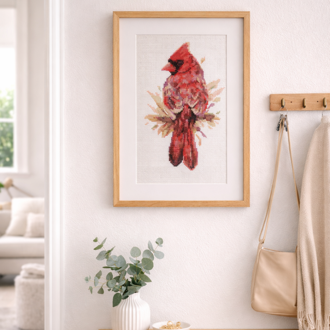 Framed red cardinal cross stitch wall art, bird embroidery decor in entryway, cardinal cross stitch pattern display