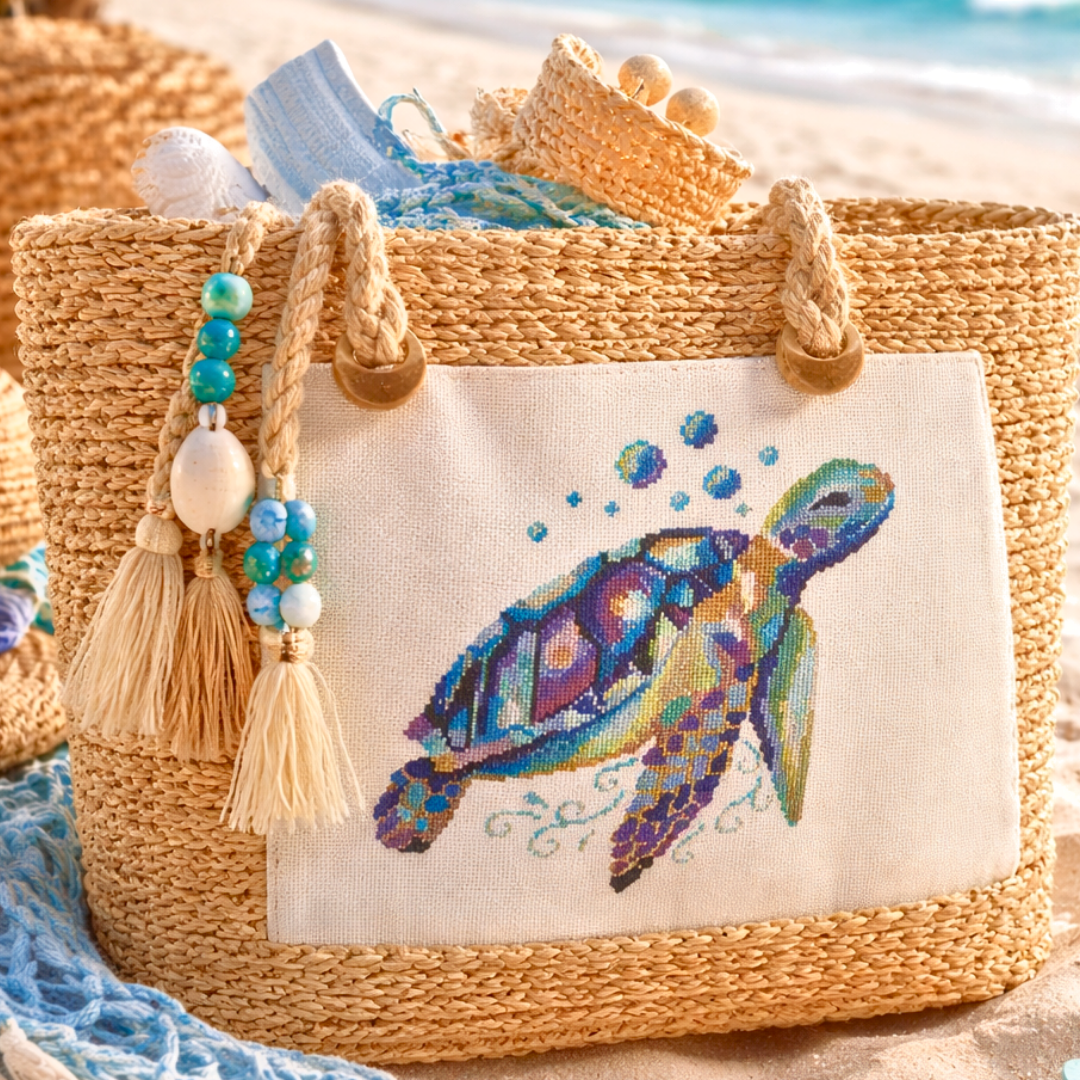 Hand embroidered sea turtle design on natural straw beach bag, ocean themed handmade accessory