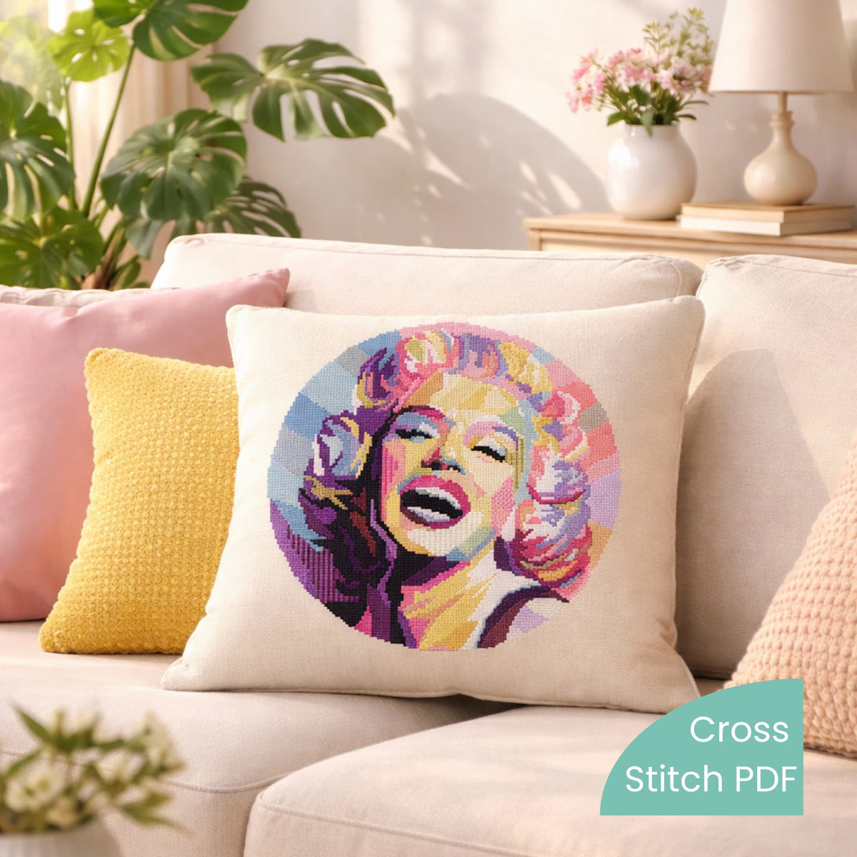 Marilyn Monroe Cross Stitch Pattern PDF digital download shown on decorative pillow with modern pop art portrait embroidery.