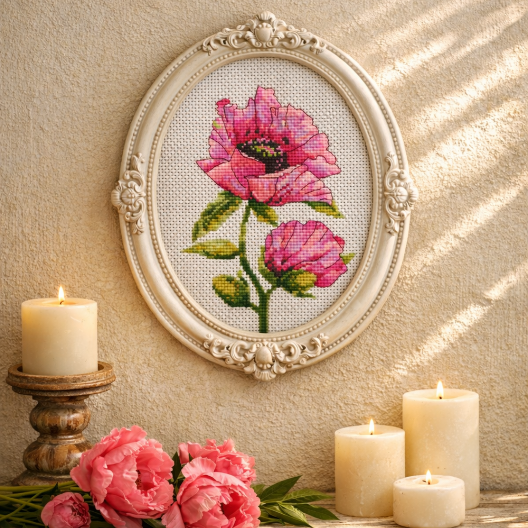 Pink poppies cross stitch pattern framed as wall art, floral embroidery decor, elegant botanical needlework artwork