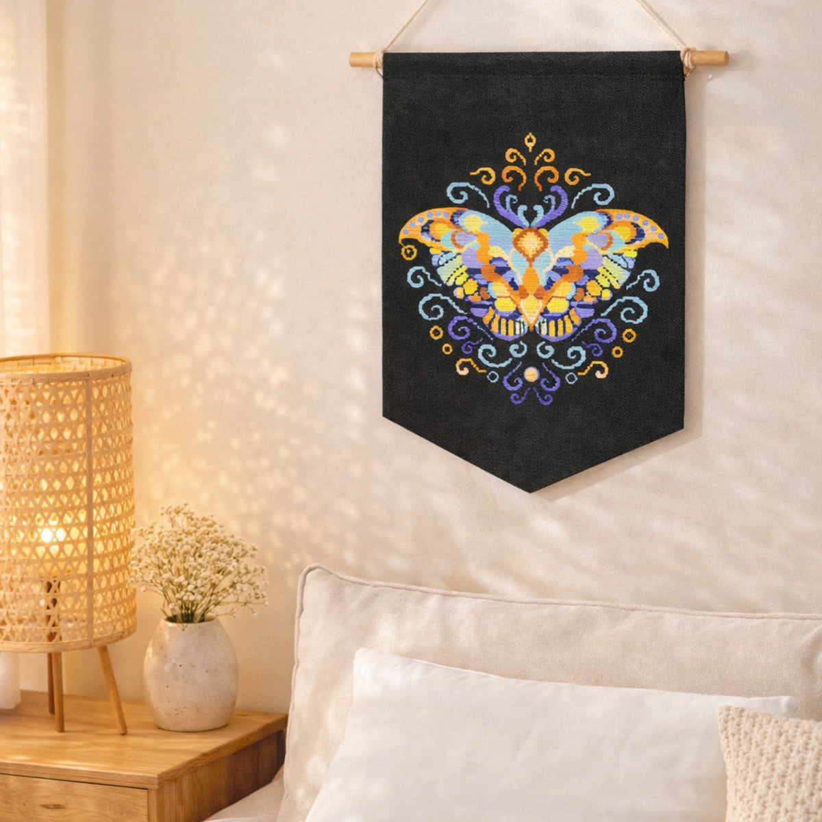 Purple Moth Cross Stitch Pattern PDF digital download displayed as wall hanging textile art with mystical butterfly embroidery.
