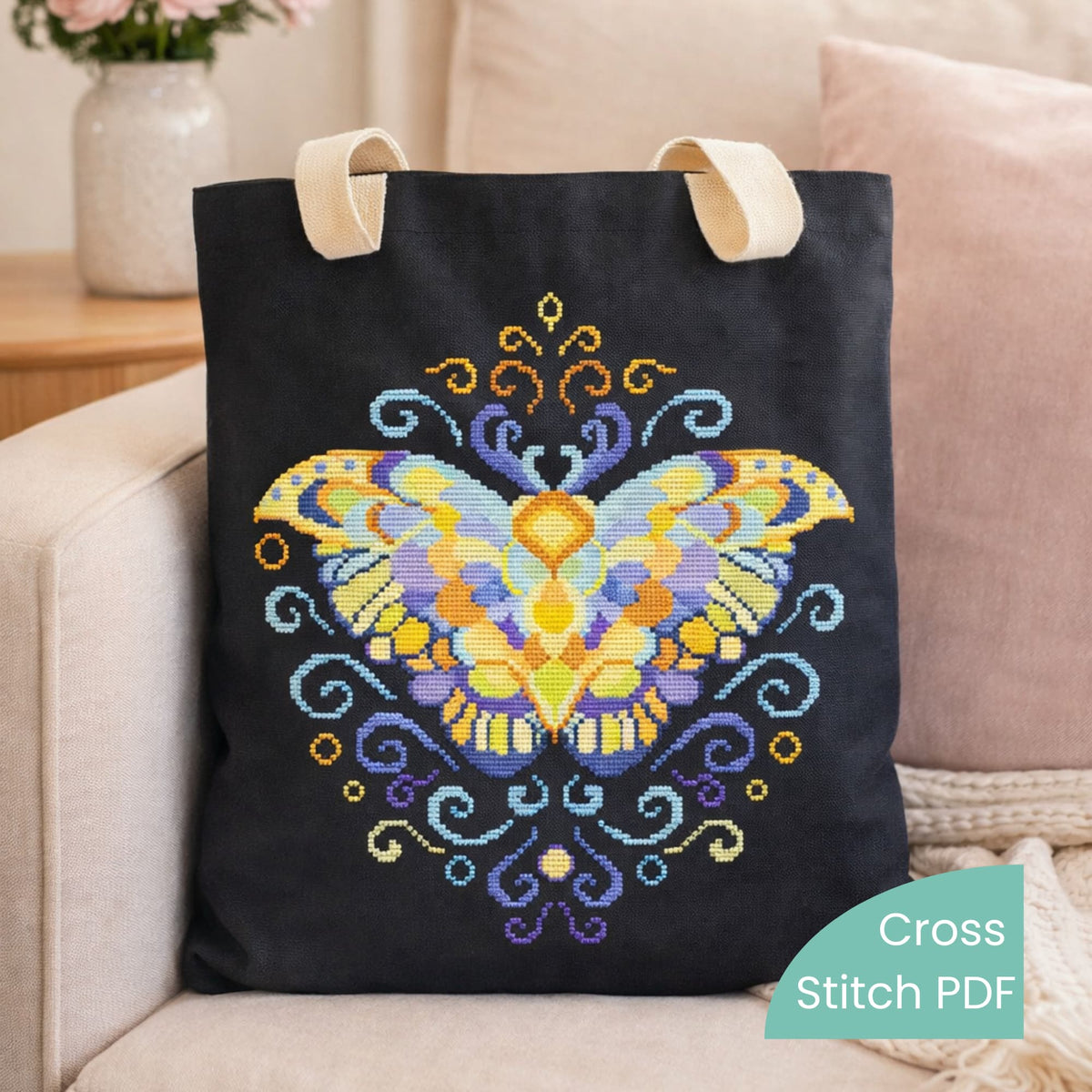 Purple Moth Cross Stitch Pattern PDF digital download featuring vibrant butterfly embroidery stitched on black cotton tote bag.