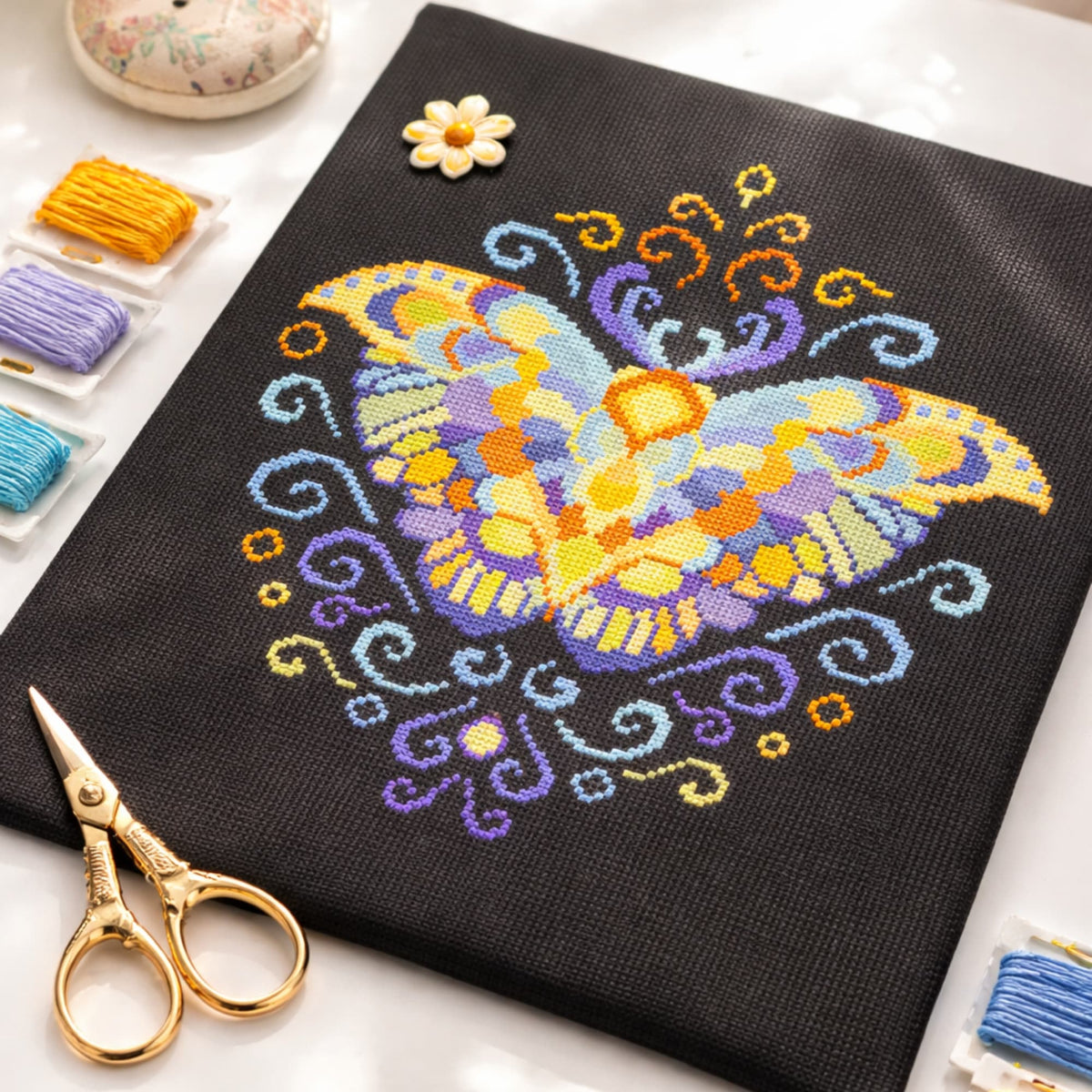 Purple Moth Cross Stitch Pattern PDF digital download showing finished butterfly embroidery with threads, scissors and accessories.