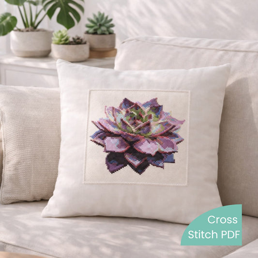 Purple Succulent Cross Stitch Pattern PDF digital download displayed on decorative pillow with modern succulent flower embroidery.