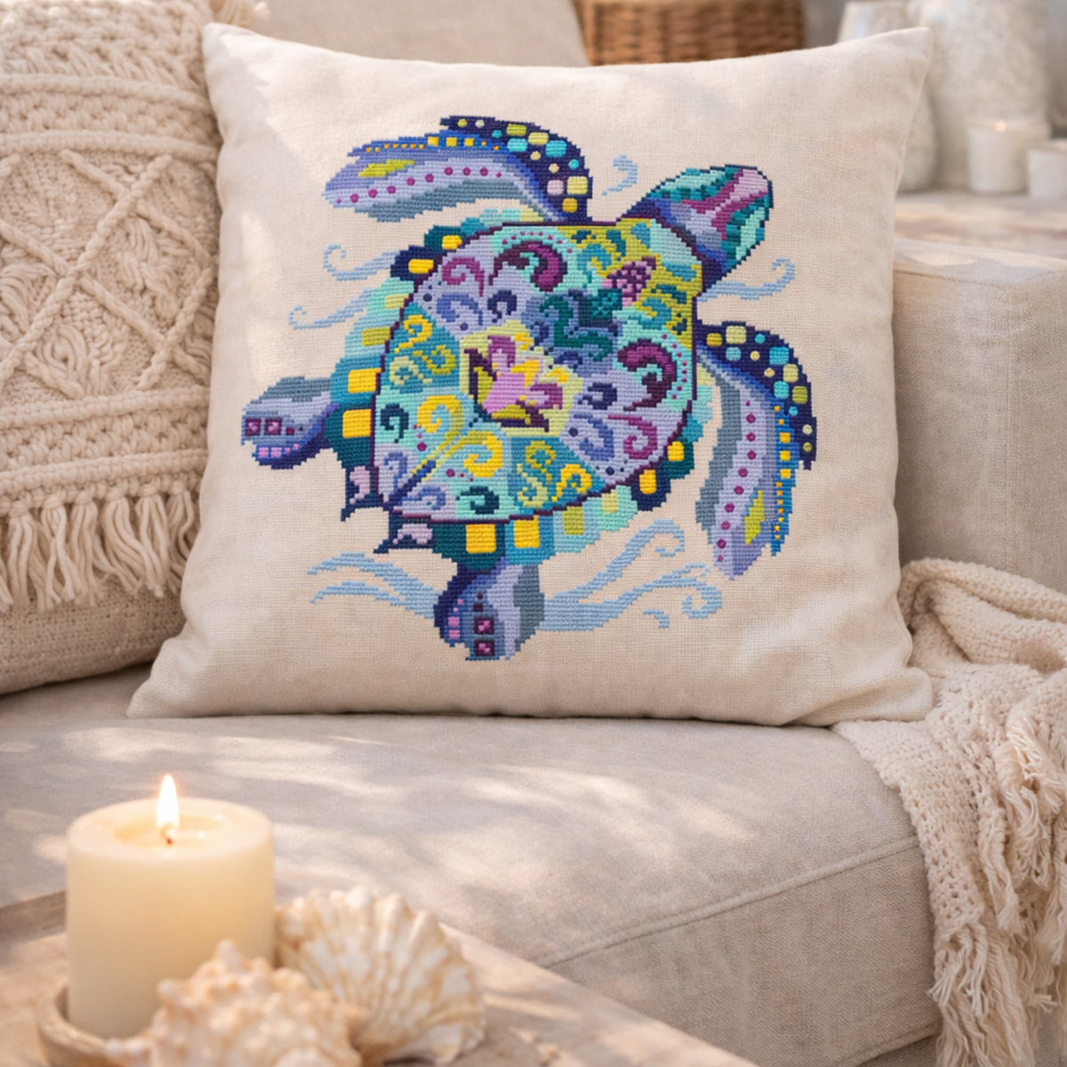 Sea turtle cross stitch kit finished design displayed on decorative pillow
