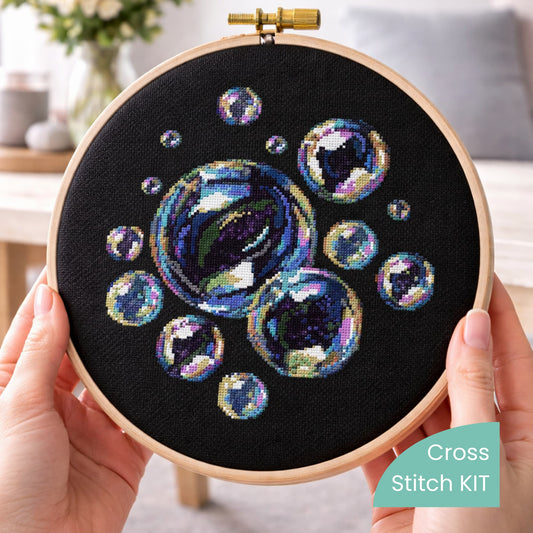 Soap bubbles cross stitch kit in embroidery hoop, iridescent bubble design on black fabric, modern cross stitch kit with all materials