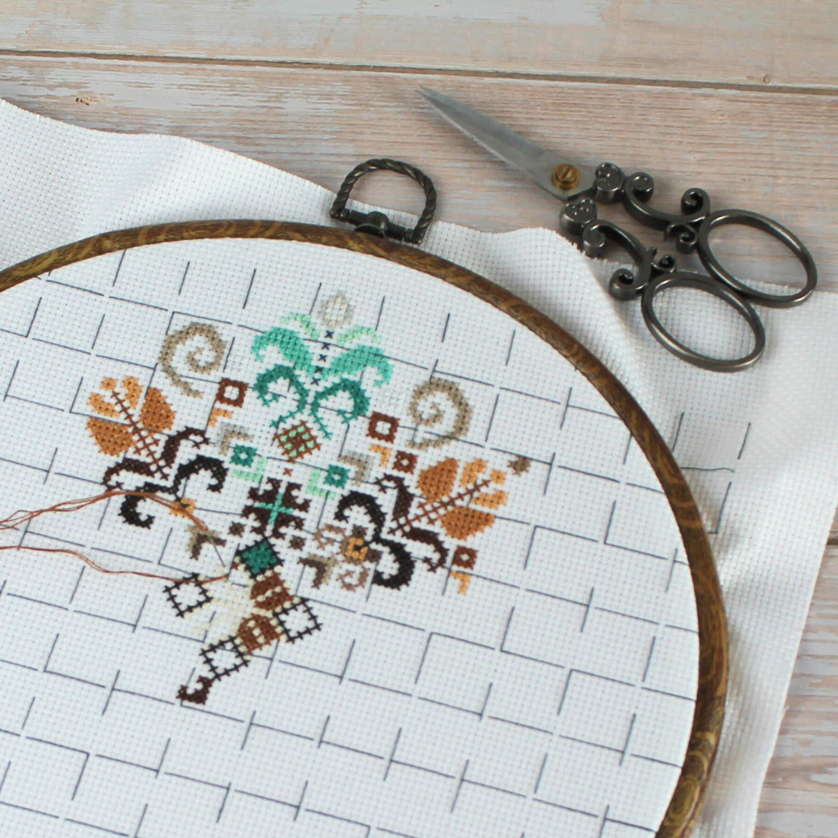 close up detailed cross stitch folk mandala